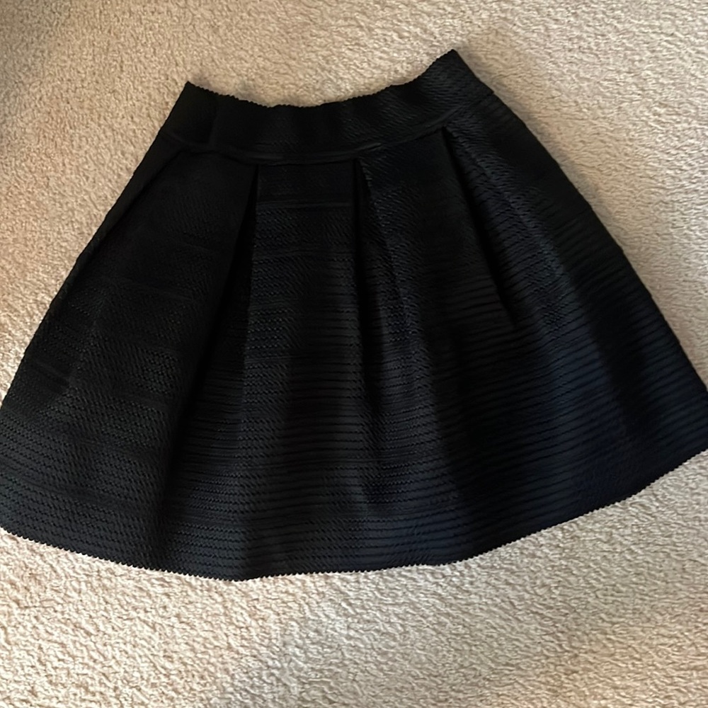 Cute pleaded short black skirt from Express  worn once in great condition